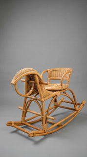 Wicker rocking chair on a gray background