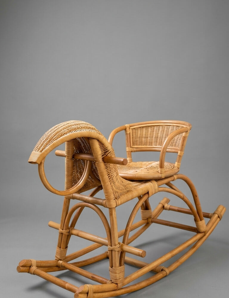 Wicker rocking chair on a gray background