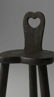 Wooden stool with a heart-shaped backrest 