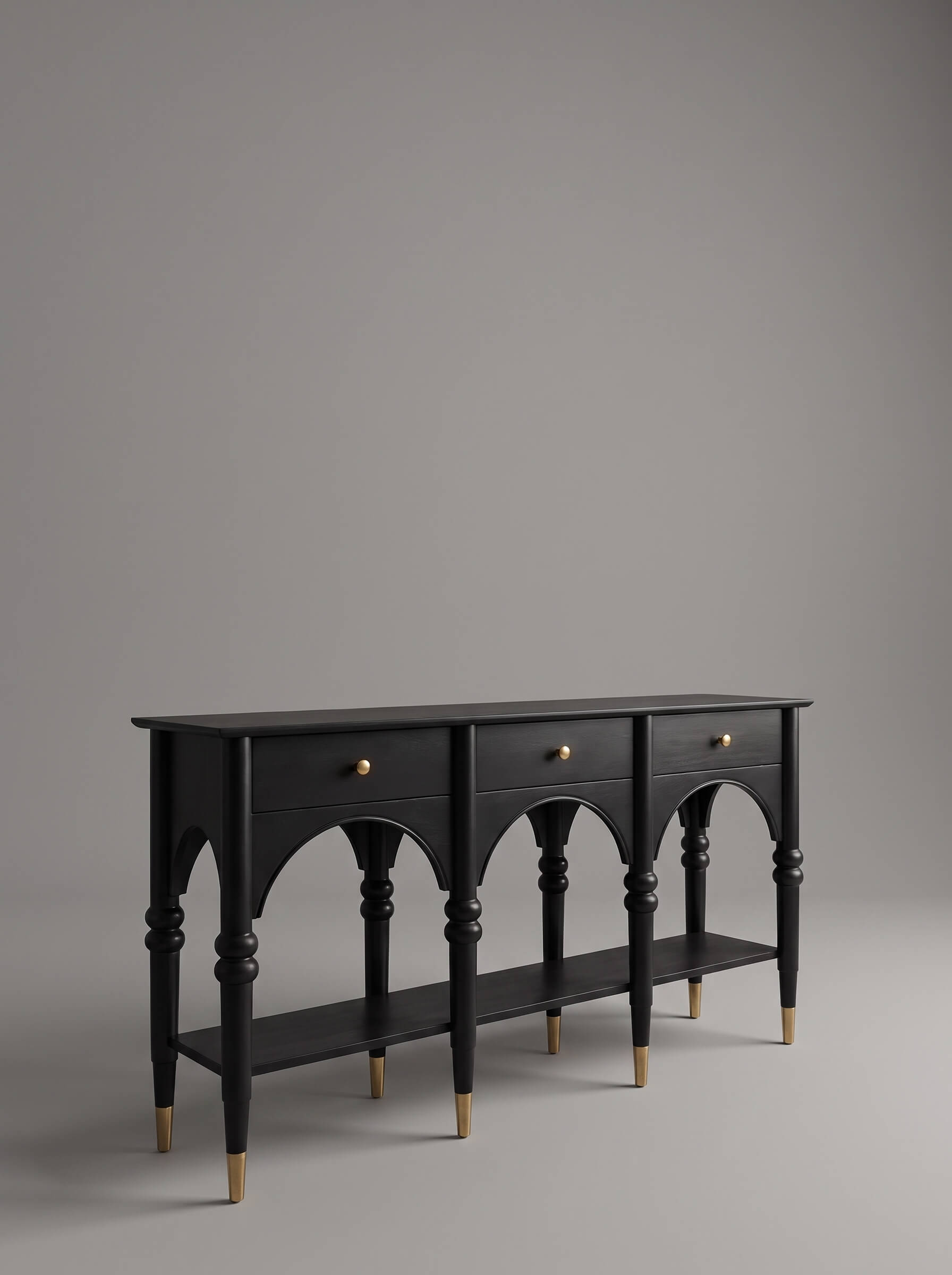 Dark teak wood console with hand-carved wooden studs and cylindrical peg legs, on grey background