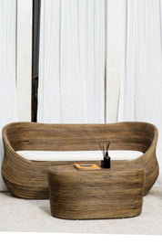 Handmade brown round rattan sofa Tegal with ecru cushions, designed for eco-friendly outdoor living on patios and terraces