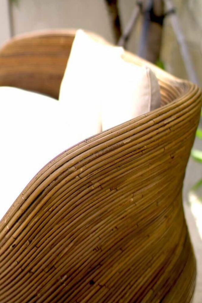 Handmade brown round rattan sofa Tegal with ecru cushions, designed for eco-friendly outdoor living on patios and terraces