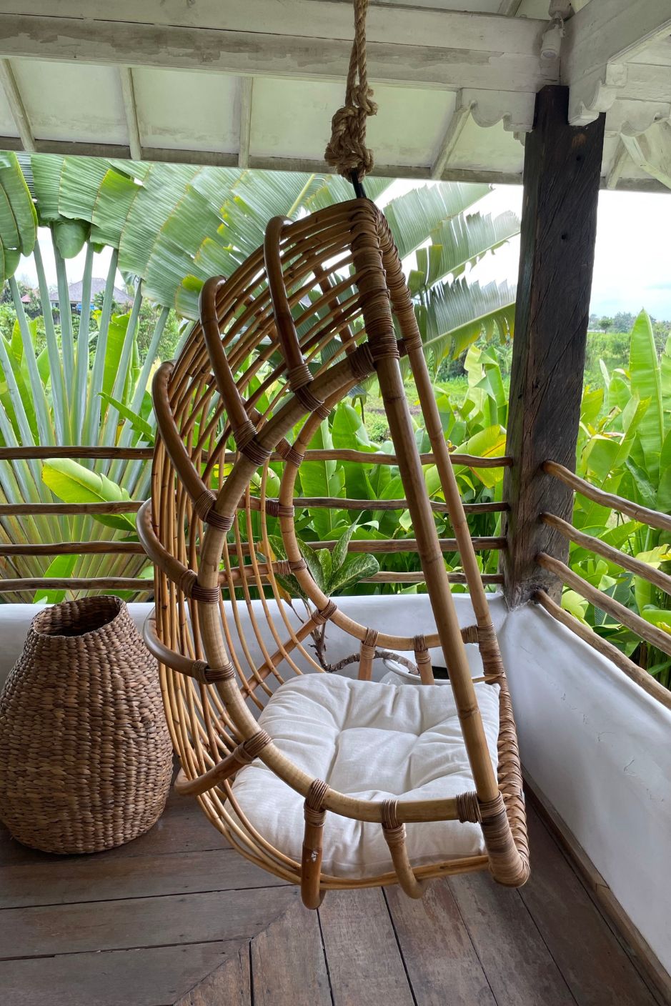 Durable handmade natural rattan hanging swing chair single, designed for relaxing indoor or outdoor comfort.