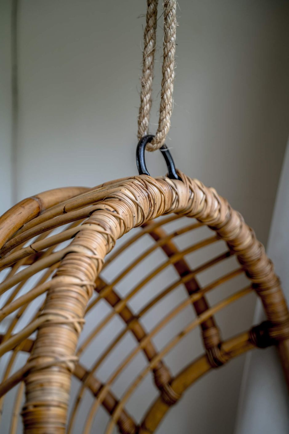 Durable handmade natural rattan hanging swing chair single, designed for relaxing indoor or outdoor comfort.