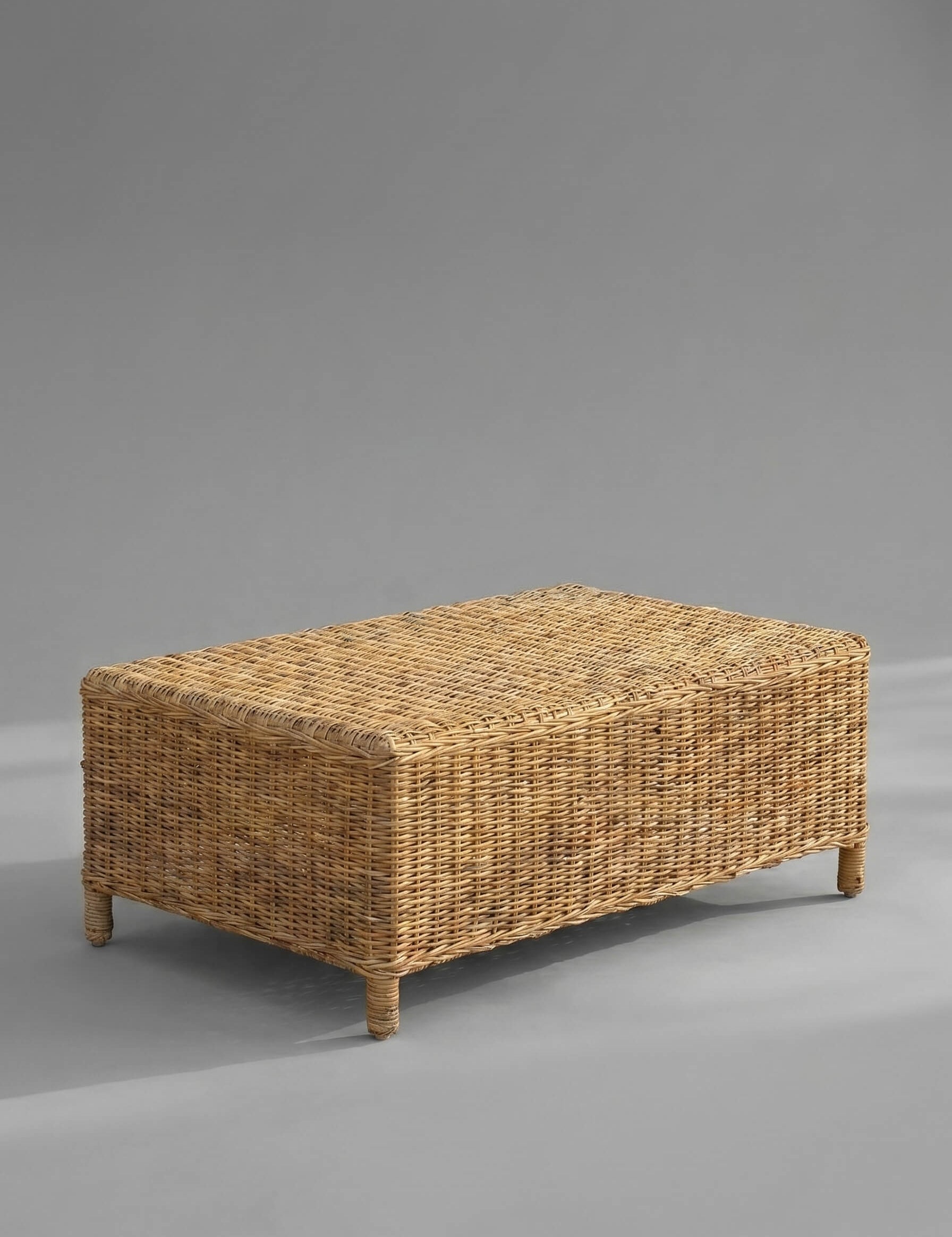 Wicker coffee table on a gray background