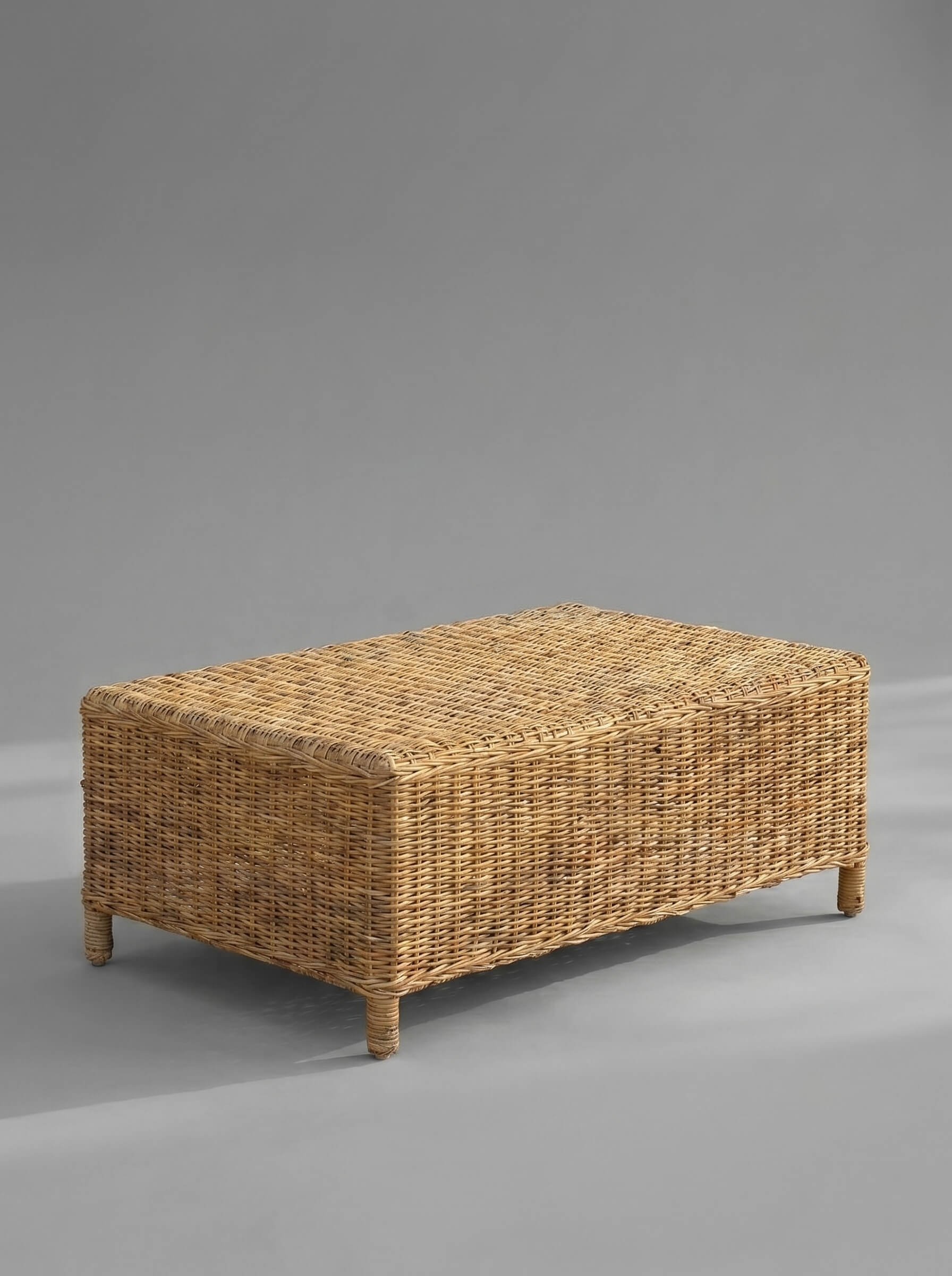 Wicker coffee table on a gray background