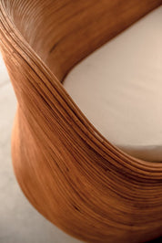 Handmade cognac round rattan sofa Tegal with ecru cushions, designed for eco-friendly outdoor living on patios and terraces