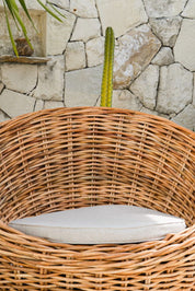 Ingka Halo cognac handmade rattan sofa lounge chair with thick weave, modern minimalist design for living rooms and lounges.