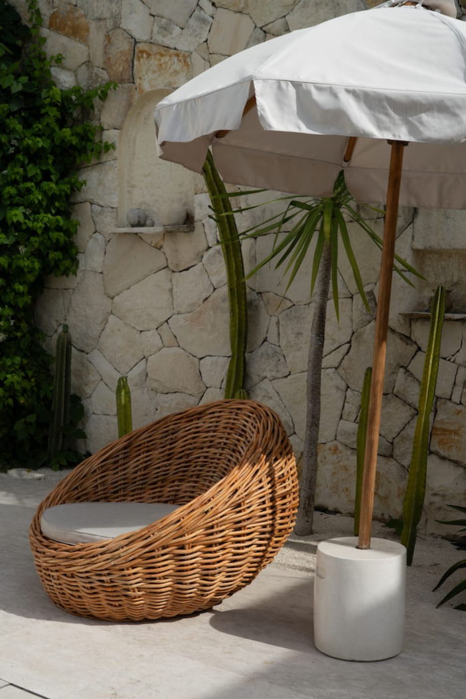 Ingka Halo cognac handmade rattan sofa lounge chair with thick weave, modern minimalist design for living rooms and lounges.