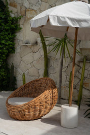 Ingka Halo cognac handmade rattan sofa lounge chair with thick weave, modern minimalist design for living rooms and lounges.