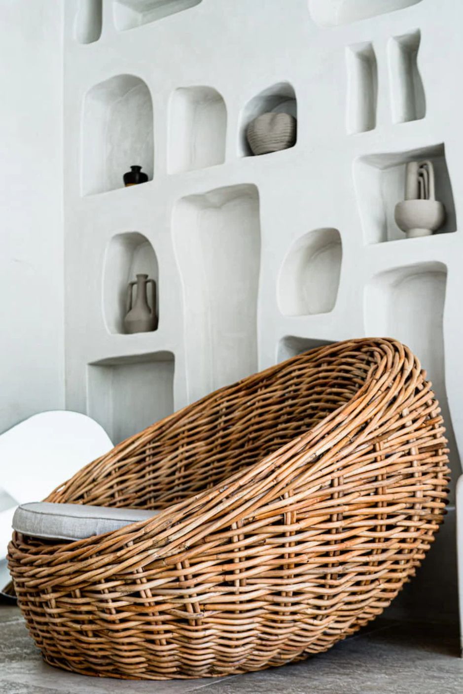 Ingka Halo cognac handmade rattan sofa lounge chair with thick weave, modern minimalist design for living rooms and lounges.