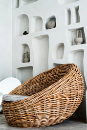 Ingka Halo cognac handmade rattan sofa lounge chair with thick weave, modern minimalist design for living rooms and lounges.