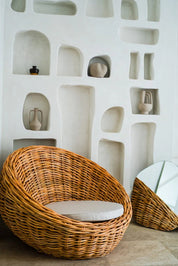 Ingka Halo cognac handmade rattan sofa lounge chair with thick weave, modern minimalist design for living rooms and lounges.