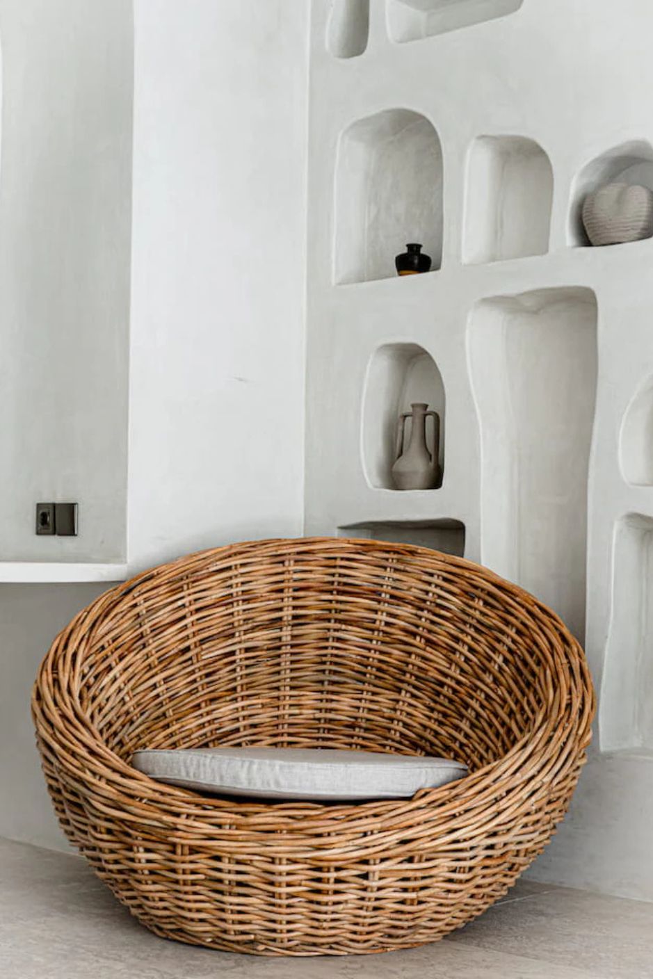 Ingka Halo cognac handmade rattan sofa lounge chair with thick weave, modern minimalist design for living rooms and lounges.