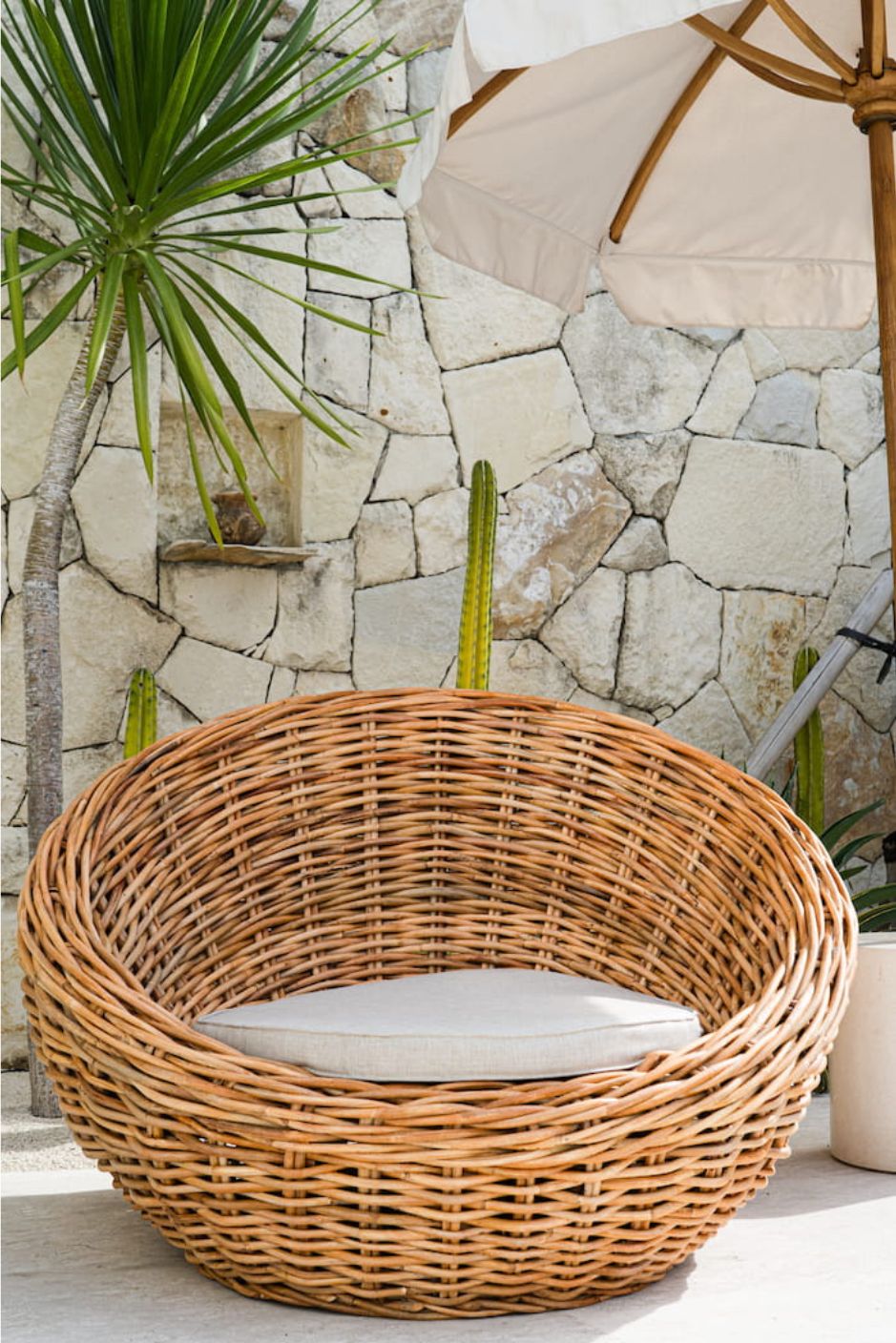 Ingka Halo cognac handmade rattan sofa lounge chair with thick weave, modern minimalist design for living rooms and lounges.