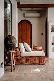 Handmade Ingka modular armchair in cognac rattan with thick weave, versatile as standalone chair or part of modular sofa for living room, terrace, or patio.