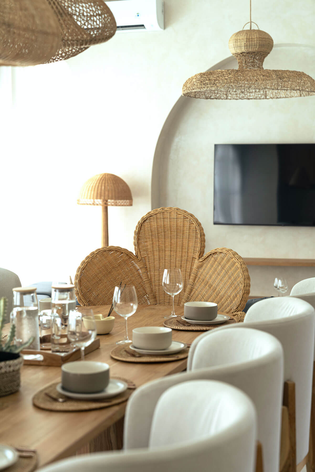 Natural rattan armchair with minimalist aesthetic
