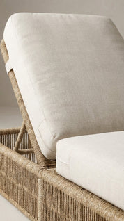 Wicker chair with white cushion 
