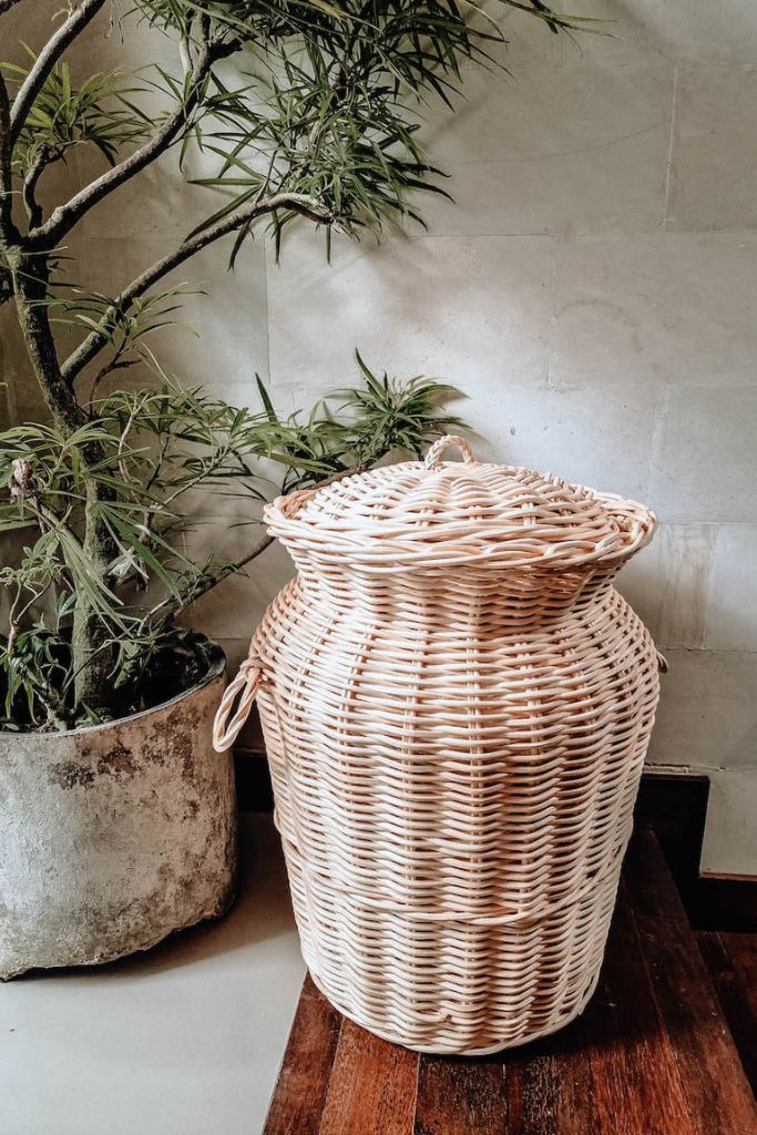 Handwoven Loomi Basket made from natural rattan, eco-friendly storage solution for bedrooms, bathrooms, living rooms, and laundry rooms, lightweight and durable, rustic and stylish home organisation accessory.