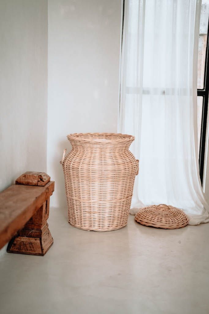 Handwoven Loomi Basket made from natural rattan, eco-friendly storage solution for bedrooms, bathrooms, living rooms, and laundry rooms, lightweight and durable, rustic and stylish home organisation accessory.