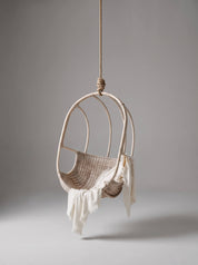 Sculptural rattan hanging chair with rounded base
