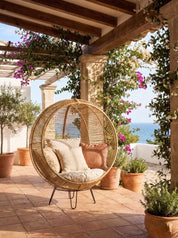 Rattanround chair styled beside lounge chair
Handcrafted rattan chair with woven texture