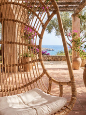 Handwoven rattan hanging chair with natural woven texture