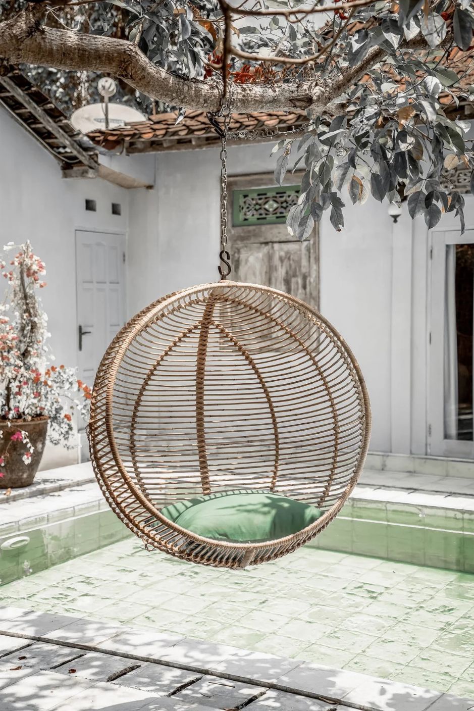 Hanging and standing rattan ball swing chair for adults and kids, available in single adult and junior sizes, handmade natural rattan, includes metal stand and rope, perfect for patio, garden, deck, or poolside, stylish boho, modern, and classic interior accessory.