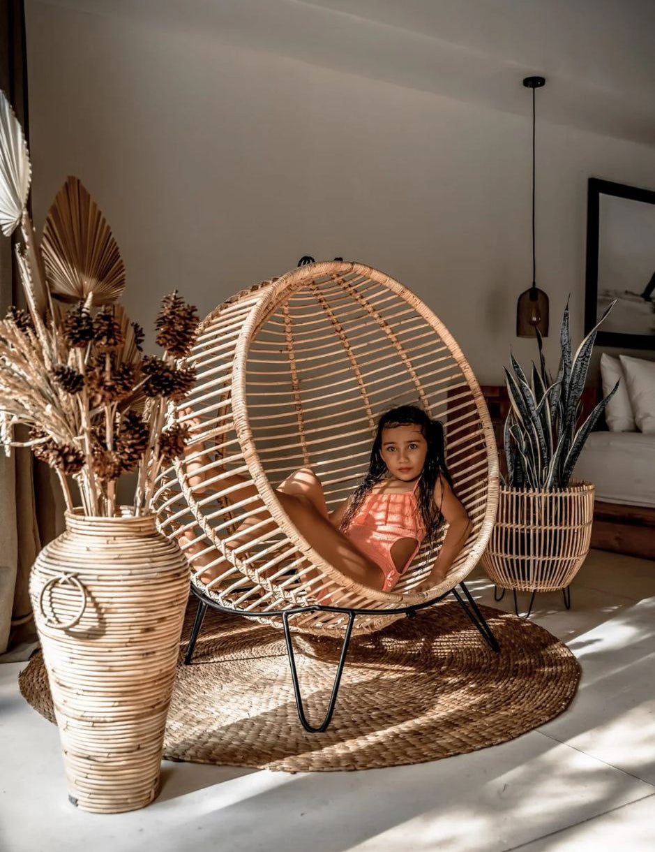 Hanging and standing rattan ball swing chair for adults and kids, available in single adult and junior sizes, handmade natural rattan, includes metal stand and rope, perfect for patio, garden, deck, or poolside, stylish boho, modern, and classic interior accessory.