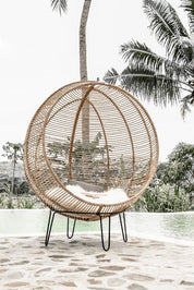 Hanging and standing rattan ball swing chair for adults and kids, available in single adult and junior sizes, handmade natural rattan, includes metal stand and rope, perfect for patio, garden, deck, or poolside, stylish boho, modern, and classic interior accessory.