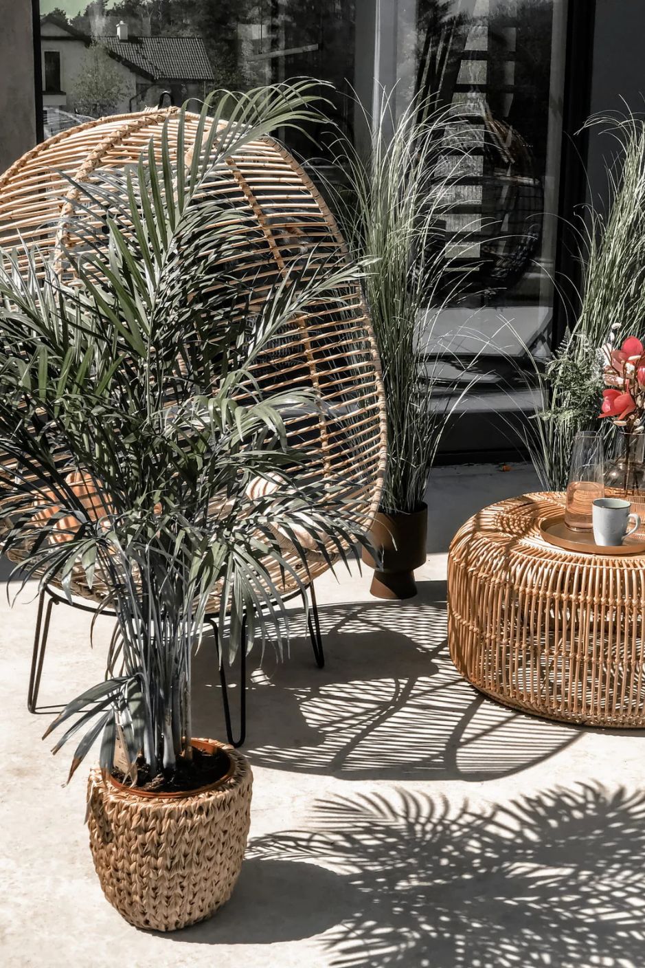 Hanging and standing rattan ball swing chair for adults and kids, available in single adult and junior sizes, handmade natural rattan, includes metal stand and rope, perfect for patio, garden, deck, or poolside, stylish boho, modern, and classic interior accessory.