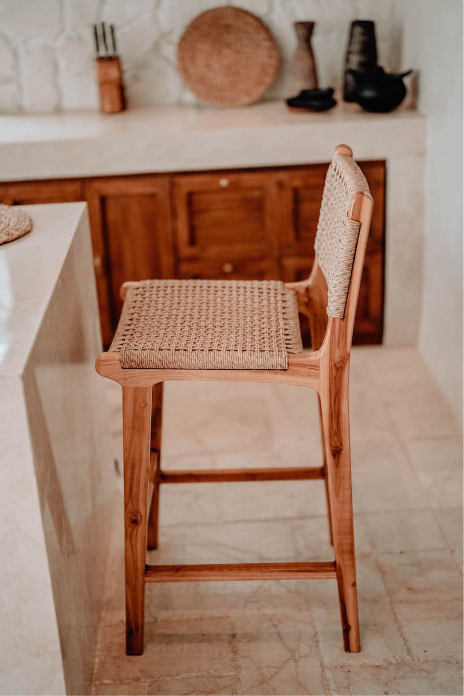 Handmade Harrison teak bar stool with woven synthetic seat and backrest, stylish and durable high chair for kitchen counters or bar tables, perfect for modern Australian interiors.