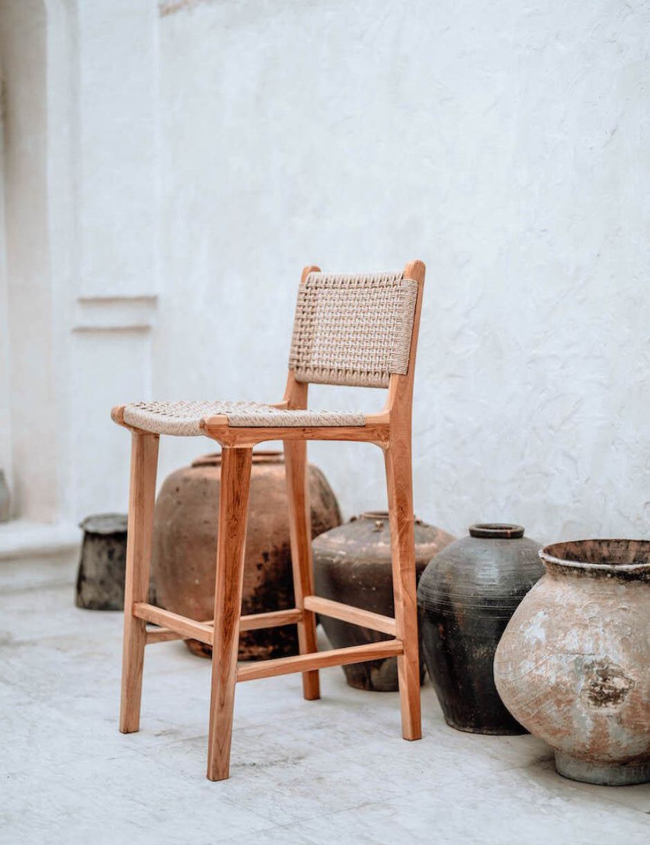 Handmade Harrison teak bar stool with woven synthetic seat and backrest, stylish and durable high chair for kitchen counters or bar tables, perfect for modern Australian interiors.