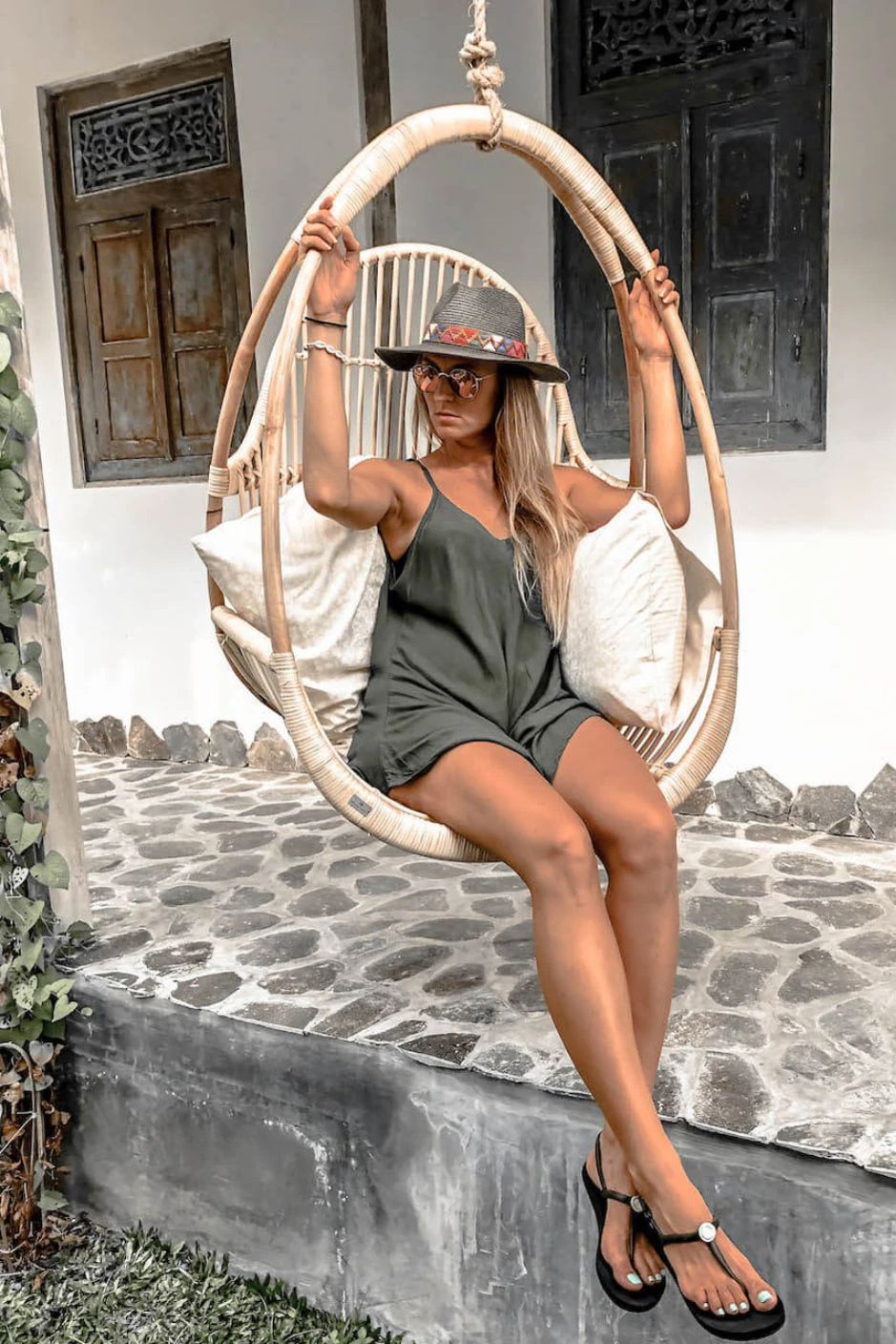 Henry single or double handmade durable light rattan hanging chair for indoor living rooms, covered terraces, patios, balconies, and outdoor gardens