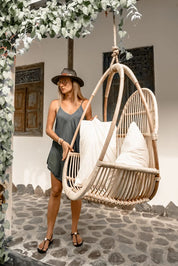 Henry single or double handmade durable light rattan hanging chair for indoor living rooms, covered terraces, patios, balconies, and outdoor gardens