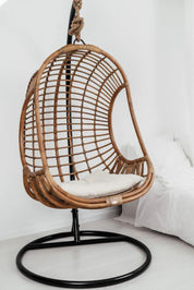 Rattan accent chair styled in living room interior
