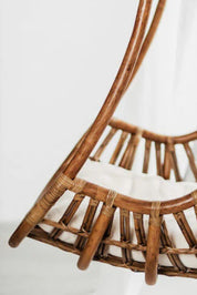 Hugo Rattan Hanging Chair in natural, cognac and brown rattan, handmade, eco-friendly, zero plastic, boho style, perfect for living room, terrace, or patio, stylish and comfortable swinging chair for modern or island-inspired interiors.