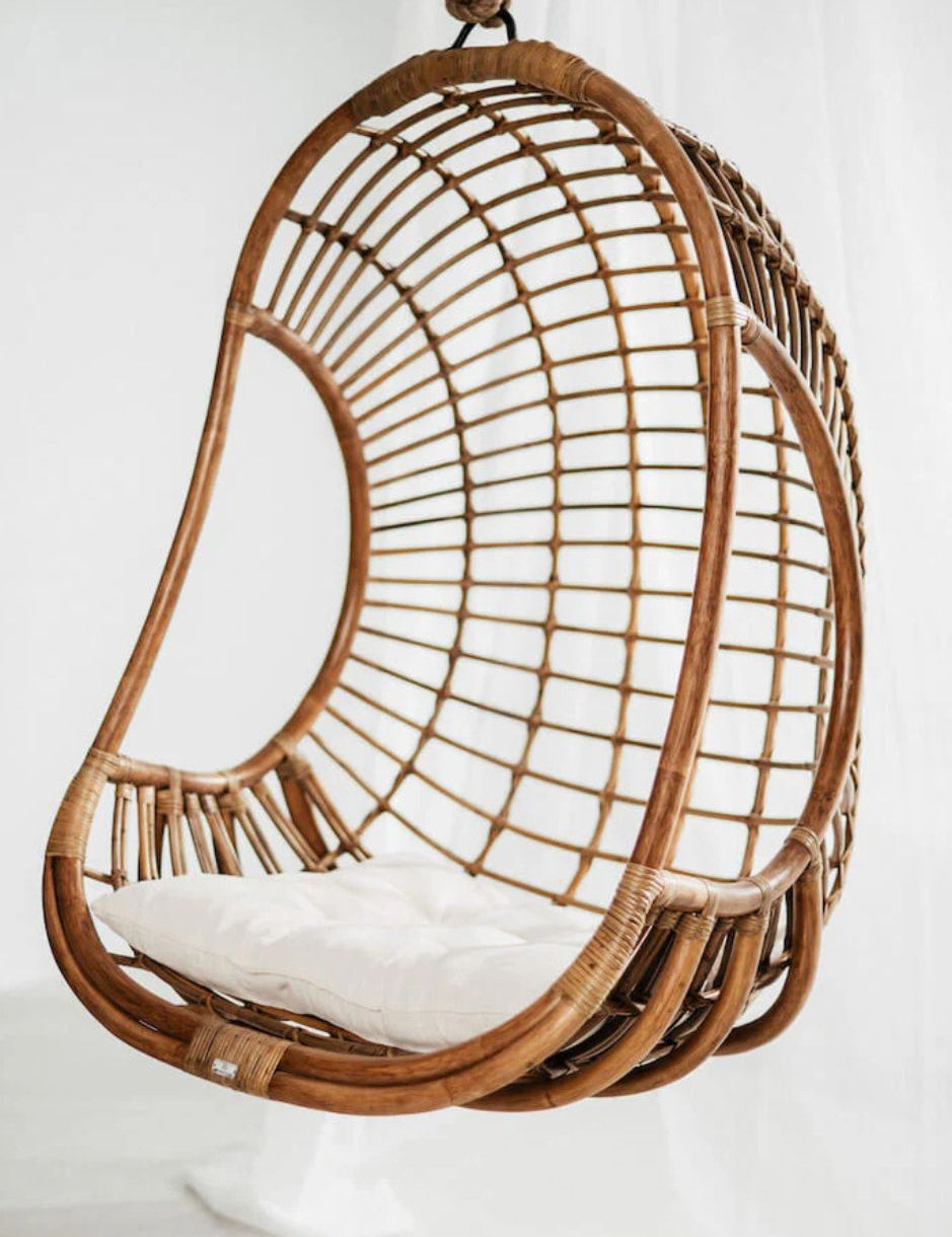 Hugo Rattan Hanging Chair in natural, cognac and brown rattan, handmade, eco-friendly, zero plastic, boho style, perfect for living room, terrace, or patio, stylish and comfortable swinging chair for modern or island-inspired interiors.