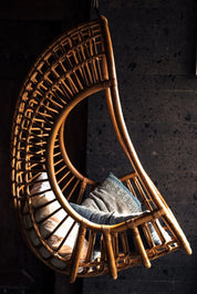 Hugo Rattan Hanging Chair in natural, cognac and brown rattan, handmade, eco-friendly, zero plastic, boho style, perfect for living room, terrace, or patio, stylish and comfortable swinging chair for modern or island-inspired interiors.