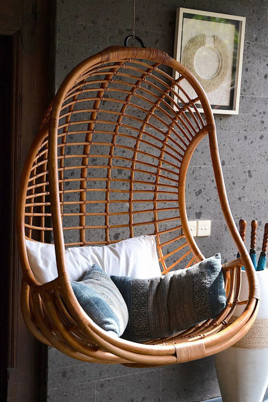 Hugo Rattan Hanging Chair in natural, cognac and brown rattan, handmade, eco-friendly, zero plastic, boho style, perfect for living room, terrace, or patio, stylish and comfortable swinging chair for modern or island-inspired interiors.