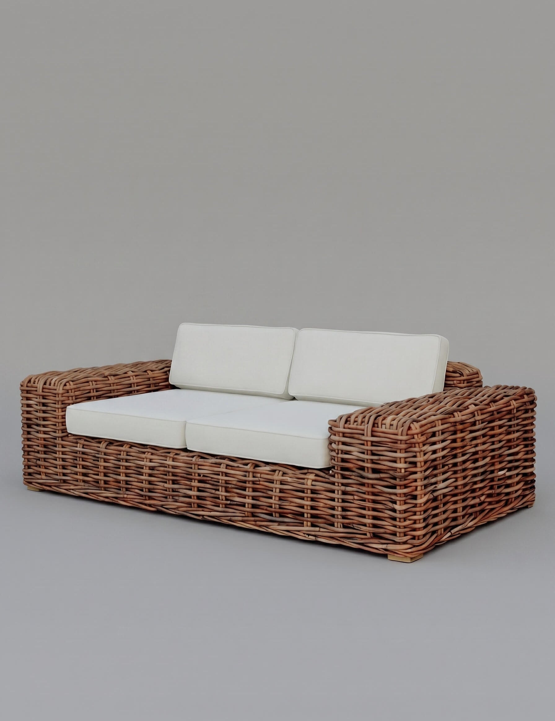 Sculptural rattan accent chair detail
Woven rattan armchair with natural finish