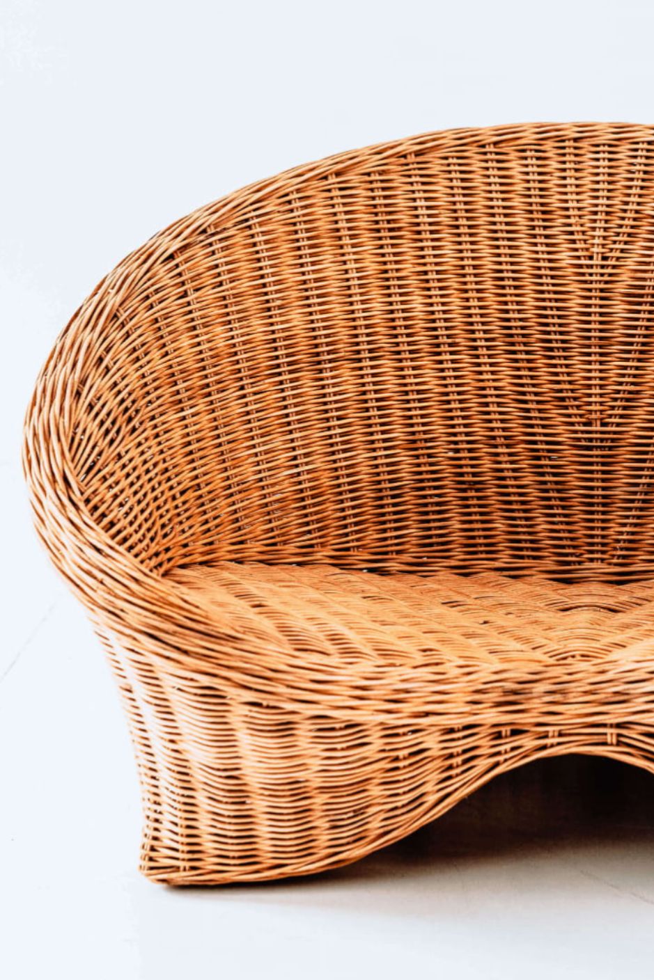 Indiana Yoga Chair handcrafted from sustainable rattan wood in natural and grey tones, ergonomic backrest and curved armrests for yoga, meditation, or relaxation, lightweight and eco-friendly indoor and outdoor seating