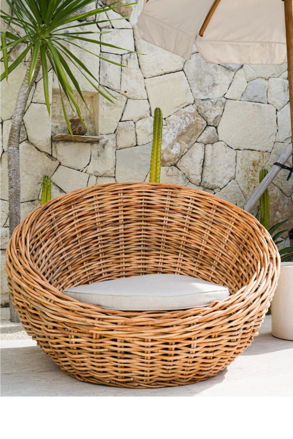 Ingka Halo cognac handmade rattan sofa lounge chair with thick weave, modern minimalist design for living rooms and lounges.