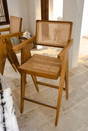 Joy Bar Stool made from durable teak wood with woven seat and backrest, ideal for kitchen islands, high countertops, and bar tables, handmade, stylish and comfortable seating for modern homes