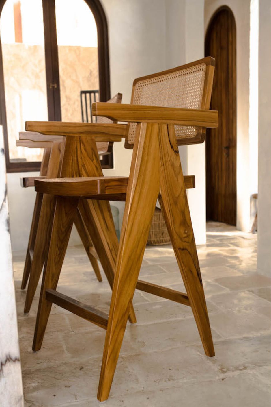 Joy Bar Stool made from durable teak wood with woven seat and backrest, ideal for kitchen islands, high countertops, and bar tables, handmade, stylish and comfortable seating for modern homes
