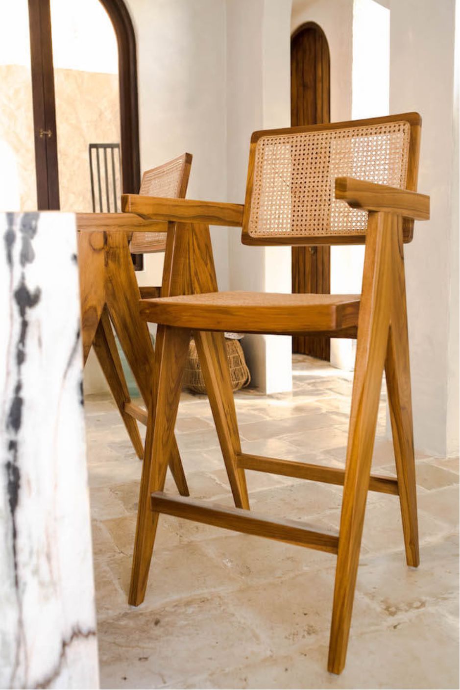 Joy Bar Stool made from durable teak wood with woven seat and backrest, ideal for kitchen islands, high countertops, and bar tables, handmade, stylish and comfortable seating for modern homes