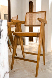 Joy Bar Stool made from durable teak wood with woven seat and backrest, ideal for kitchen islands, high countertops, and bar tables, handmade, stylish and comfortable seating for modern homes