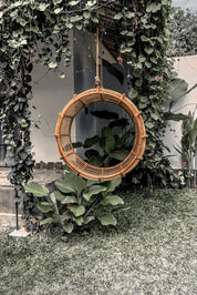 Durable handmade natural rattan hanging swing chair junior, designed for relaxing indoor or outdoor comfort.