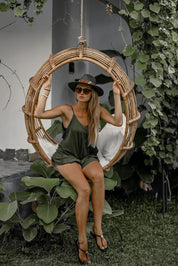 Durable handmade natural rattan hanging swing chair single, designed for relaxing indoor or outdoor comfort.