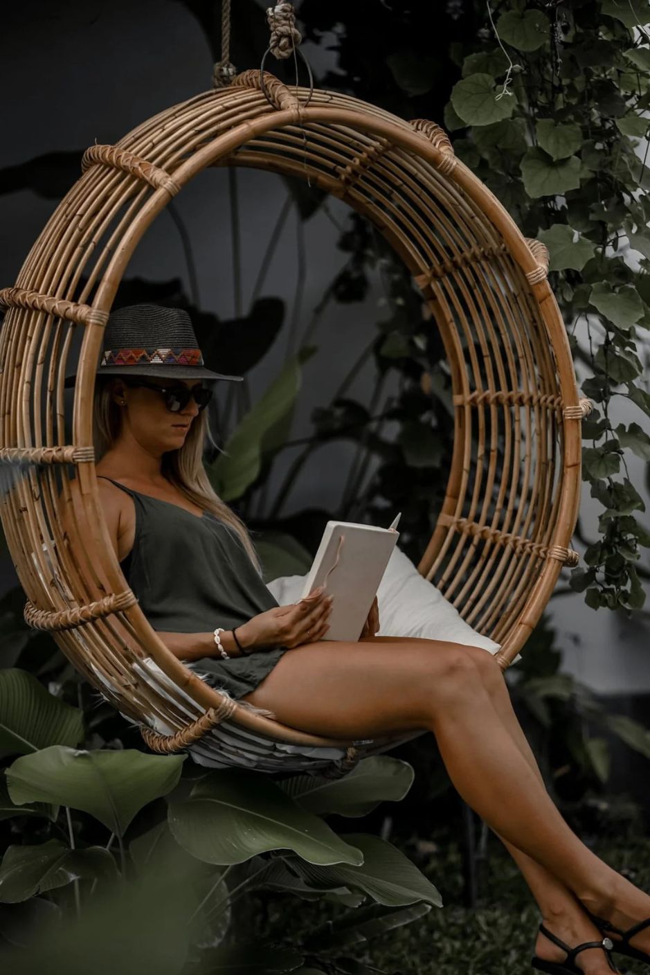 Durable handmade natural rattan hanging swing chair single, designed for relaxing indoor or outdoor comfort.